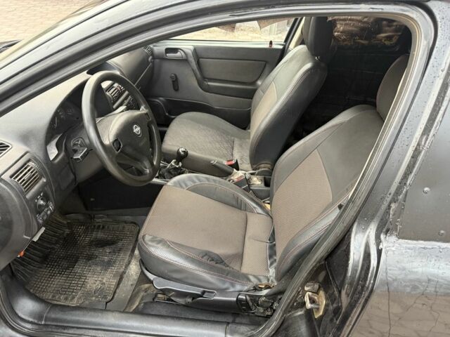 Черный Опель Астра, объемом двигателя 1.7 л и пробегом 666 тыс. км за 1375 $, фото 10 на Automoto.ua