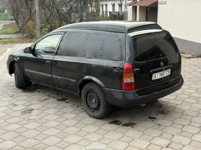 Черный Опель Астра, объемом двигателя 1.7 л и пробегом 666 тыс. км за 1375 $, фото 6 на Automoto.ua