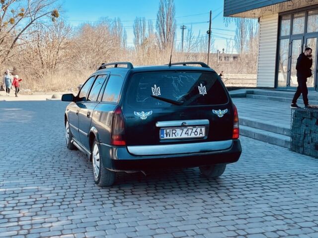 Черный Опель Астра, объемом двигателя 2 л и пробегом 400 тыс. км за 1250 $, фото 2 на Automoto.ua