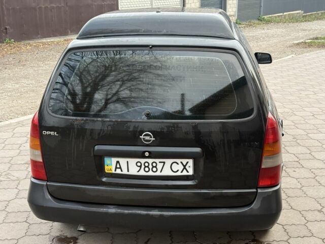 Черный Опель Астра, объемом двигателя 1.7 л и пробегом 666 тыс. км за 1375 $, фото 5 на Automoto.ua