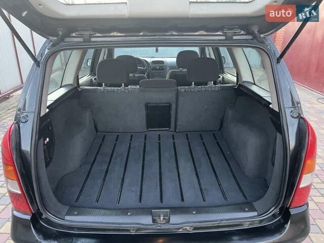 Черный Опель Астра, объемом двигателя 2 л и пробегом 223 тыс. км за 2999 $, фото 38 на Automoto.ua