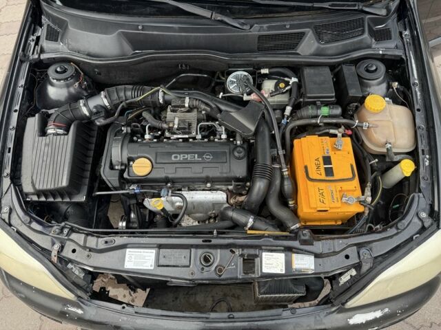 Черный Опель Астра, объемом двигателя 1.7 л и пробегом 666 тыс. км за 1375 $, фото 8 на Automoto.ua