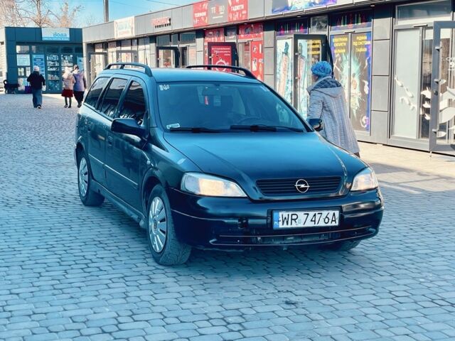 Черный Опель Астра, объемом двигателя 2 л и пробегом 400 тыс. км за 1250 $, фото 1 на Automoto.ua