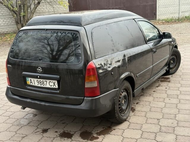 Черный Опель Астра, объемом двигателя 1.7 л и пробегом 666 тыс. км за 1375 $, фото 4 на Automoto.ua