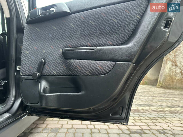 Черный Опель Астра, объемом двигателя 2 л и пробегом 337 тыс. км за 3850 $, фото 61 на Automoto.ua