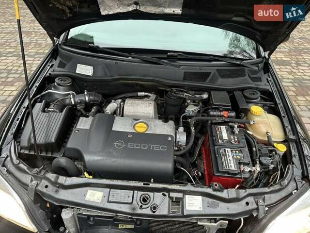 Черный Опель Астра, объемом двигателя 2 л и пробегом 340 тыс. км за 3900 $, фото 91 на Automoto.ua