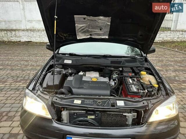 Черный Опель Астра, объемом двигателя 2 л и пробегом 340 тыс. км за 3900 $, фото 98 на Automoto.ua