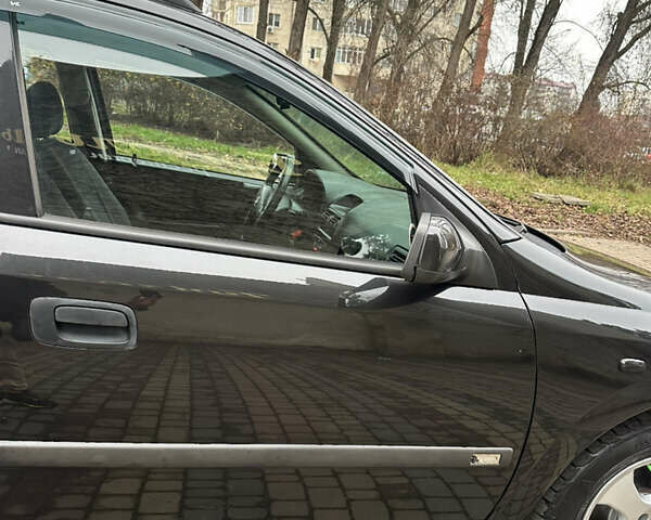 Черный Опель Астра, объемом двигателя 2 л и пробегом 337 тыс. км за 3850 $, фото 34 на Automoto.ua