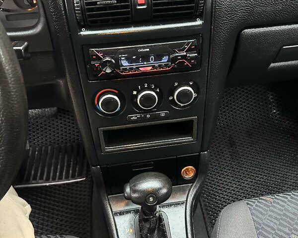 Черный Опель Астра, объемом двигателя 2 л и пробегом 337 тыс. км за 3850 $, фото 88 на Automoto.ua