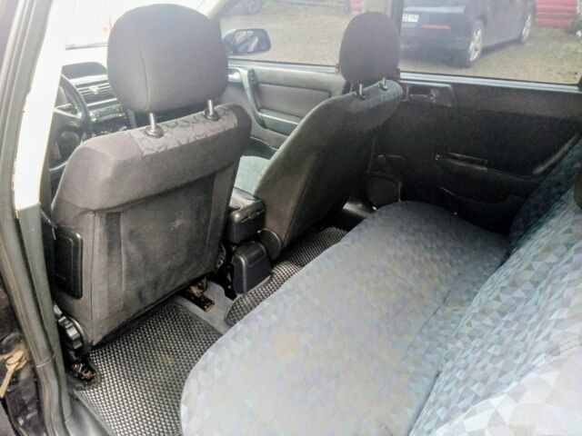 Черный Опель Астра, объемом двигателя 1.6 л и пробегом 350 тыс. км за 2650 $, фото 8 на Automoto.ua