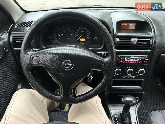 Черный Опель Астра, объемом двигателя 2 л и пробегом 337 тыс. км за 3850 $, фото 103 на Automoto.ua