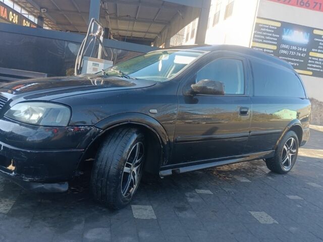 Черный Опель Астра, объемом двигателя 5 л и пробегом 330 тыс. км за 1420 $, фото 1 на Automoto.ua