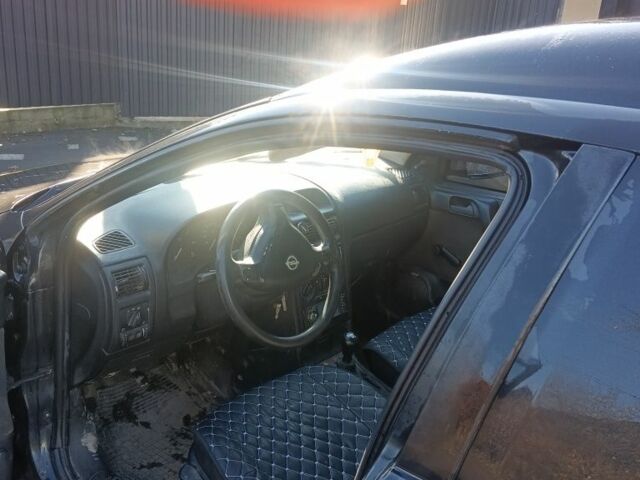 Черный Опель Астра, объемом двигателя 5 л и пробегом 330 тыс. км за 1420 $, фото 5 на Automoto.ua