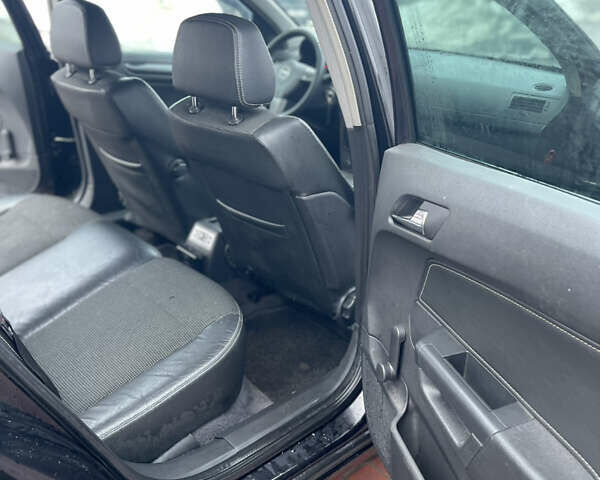 Черный Опель Астра, объемом двигателя 1.9 л и пробегом 220 тыс. км за 3750 $, фото 11 на Automoto.ua