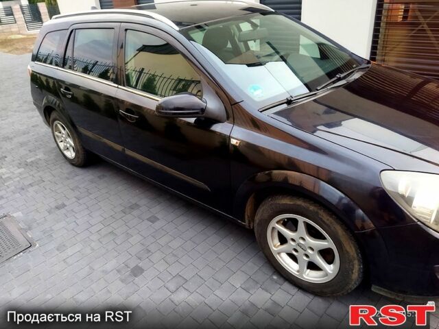 Черный Опель Астра, объемом двигателя 1.8 л и пробегом 218 тыс. км за 3500 $, фото 2 на Automoto.ua