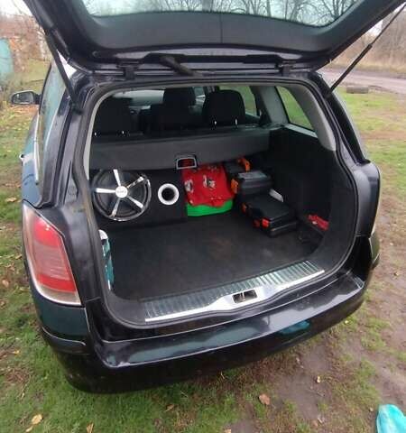 Черный Опель Астра, объемом двигателя 1.9 л и пробегом 320 тыс. км за 4999 $, фото 6 на Automoto.ua