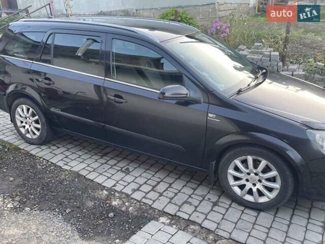 Черный Опель Астра, объемом двигателя 1.7 л и пробегом 240 тыс. км за 3500 $, фото 4 на Automoto.ua