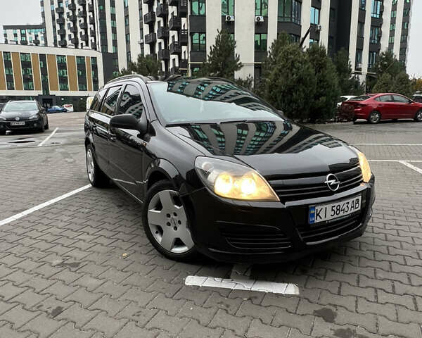 Черный Опель Астра, объемом двигателя 1.7 л и пробегом 330 тыс. км за 5200 $, фото 1 на Automoto.ua