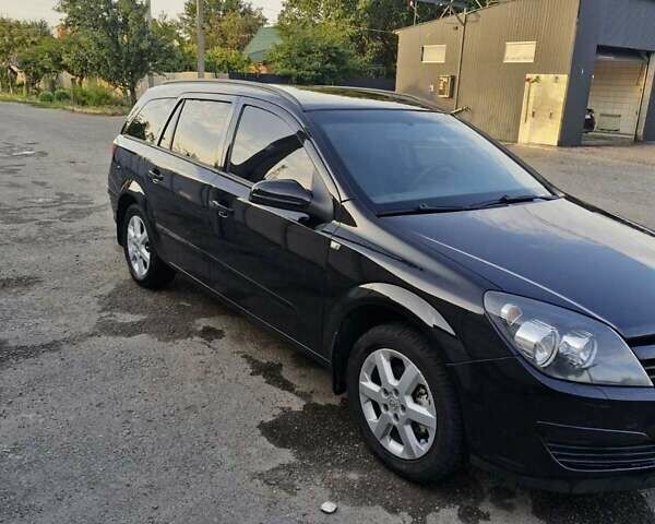 Черный Опель Астра, объемом двигателя 1.6 л и пробегом 270 тыс. км за 5300 $, фото 9 на Automoto.ua