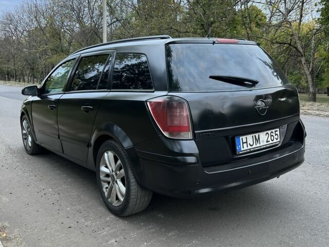 Черный Опель Астра, объемом двигателя 1.9 л и пробегом 333 тыс. км за 2600 $, фото 2 на Automoto.ua