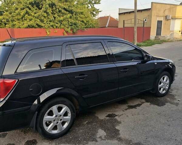 Черный Опель Астра, объемом двигателя 1.6 л и пробегом 270 тыс. км за 5300 $, фото 12 на Automoto.ua