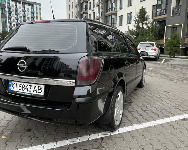Черный Опель Астра, объемом двигателя 1.7 л и пробегом 330 тыс. км за 5200 $, фото 11 на Automoto.ua