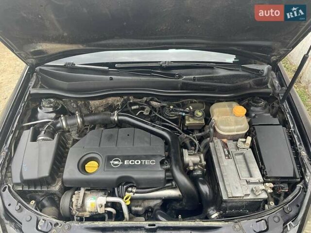 Черный Опель Астра, объемом двигателя 1.7 л и пробегом 440 тыс. км за 3150 $, фото 4 на Automoto.ua