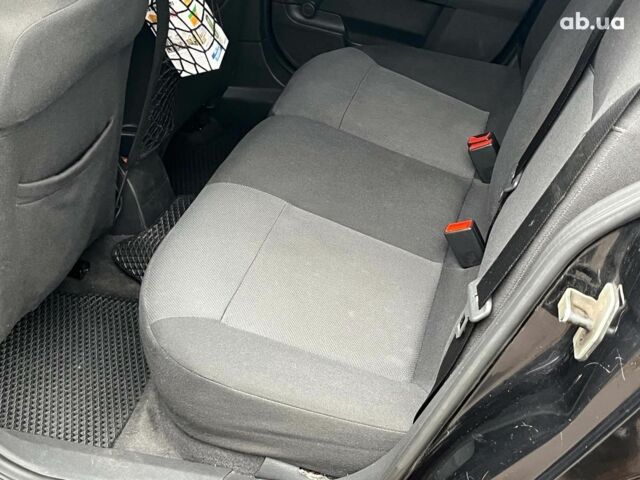 Черный Опель Астра, объемом двигателя 1.6 л и пробегом 340 тыс. км за 5140 $, фото 22 на Automoto.ua