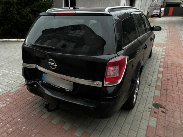 Черный Опель Астра, объемом двигателя 1.9 л и пробегом 311 тыс. км за 2930 $, фото 14 на Automoto.ua