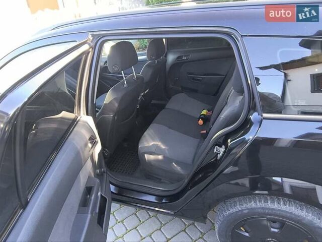 Черный Опель Астра, объемом двигателя 1.8 л и пробегом 245 тыс. км за 4900 $, фото 12 на Automoto.ua