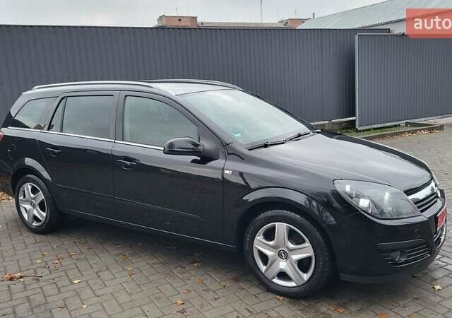 Черный Опель Астра, объемом двигателя 1.8 л и пробегом 165 тыс. км за 5650 $, фото 15 на Automoto.ua