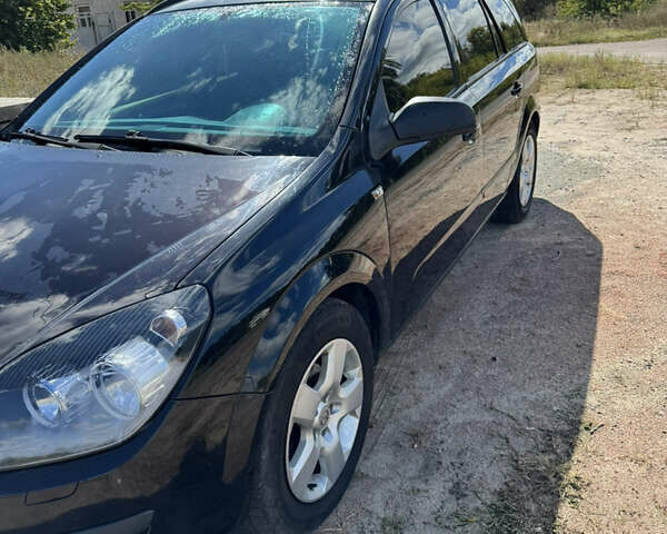 Черный Опель Астра, объемом двигателя 1.6 л и пробегом 248 тыс. км за 5200 $, фото 1 на Automoto.ua