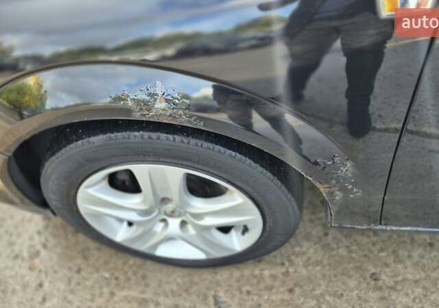 Черный Опель Астра, объемом двигателя 1.6 л и пробегом 264 тыс. км за 4700 $, фото 2 на Automoto.ua