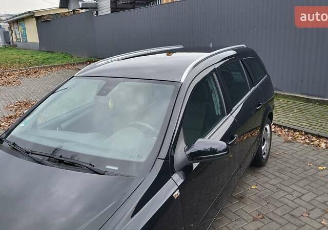 Черный Опель Астра, объемом двигателя 1.8 л и пробегом 165 тыс. км за 5650 $, фото 16 на Automoto.ua