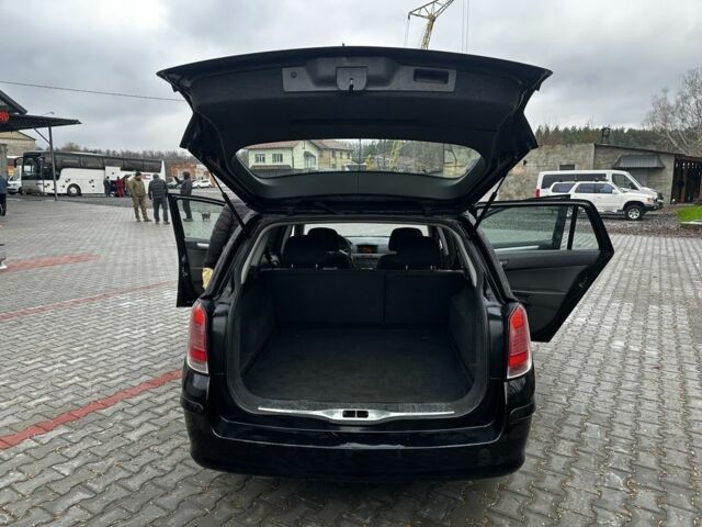 Черный Опель Астра, объемом двигателя 1.9 л и пробегом 286 тыс. км за 2050 $, фото 12 на Automoto.ua