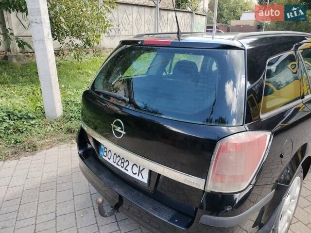 Черный Опель Астра, объемом двигателя 1.3 л и пробегом 268 тыс. км за 4550 $, фото 3 на Automoto.ua