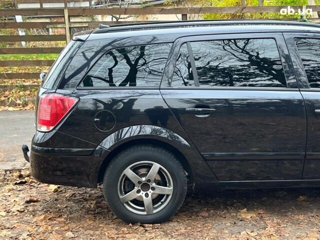 Черный Опель Астра, объемом двигателя 1.6 л и пробегом 340 тыс. км за 5140 $, фото 12 на Automoto.ua