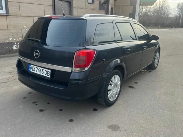 Черный Опель Астра, объемом двигателя 1.2 л и пробегом 300 тыс. км за 3400 $, фото 2 на Automoto.ua