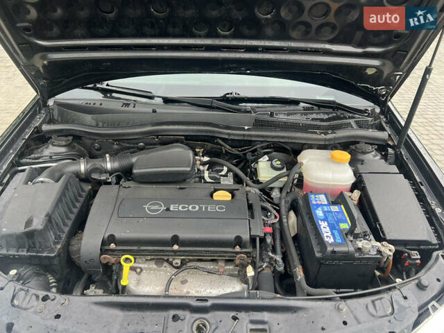 Черный Опель Астра, объемом двигателя 1.6 л и пробегом 208 тыс. км за 4000 $, фото 16 на Automoto.ua