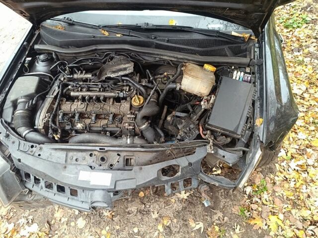 Черный Опель Астра, объемом двигателя 1.9 л и пробегом 240 тыс. км за 2600 $, фото 4 на Automoto.ua