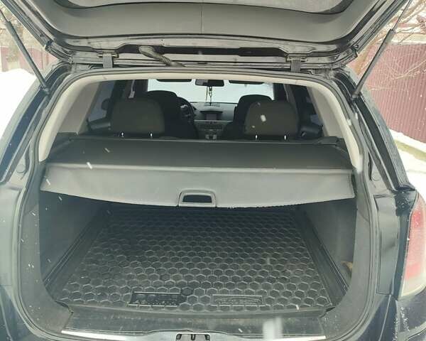 Черный Опель Астра, объемом двигателя 1.7 л и пробегом 340 тыс. км за 5100 $, фото 6 на Automoto.ua