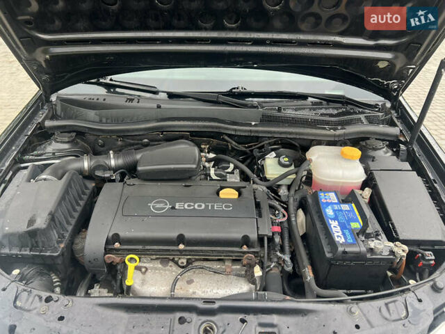 Черный Опель Астра, объемом двигателя 1.6 л и пробегом 208 тыс. км за 4000 $, фото 15 на Automoto.ua