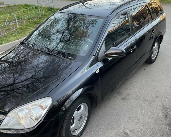 Черный Опель Астра, объемом двигателя 1.6 л и пробегом 190 тыс. км за 5000 $, фото 3 на Automoto.ua