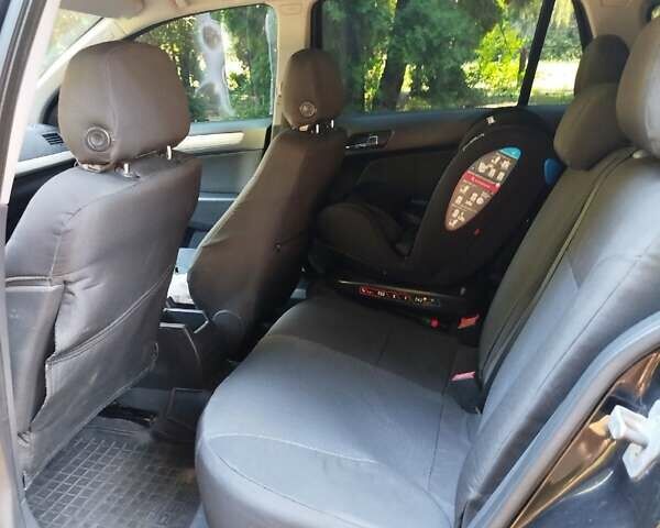 Черный Опель Астра, объемом двигателя 1.6 л и пробегом 228 тыс. км за 5800 $, фото 1 на Automoto.ua