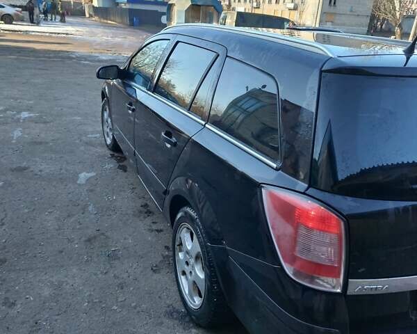 Черный Опель Астра, объемом двигателя 1.9 л и пробегом 294 тыс. км за 4000 $, фото 4 на Automoto.ua