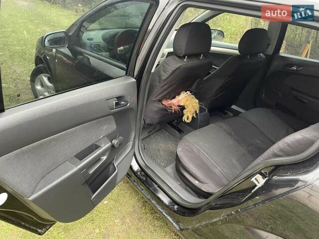 Черный Опель Астра, объемом двигателя 1.6 л и пробегом 272 тыс. км за 5100 $, фото 12 на Automoto.ua