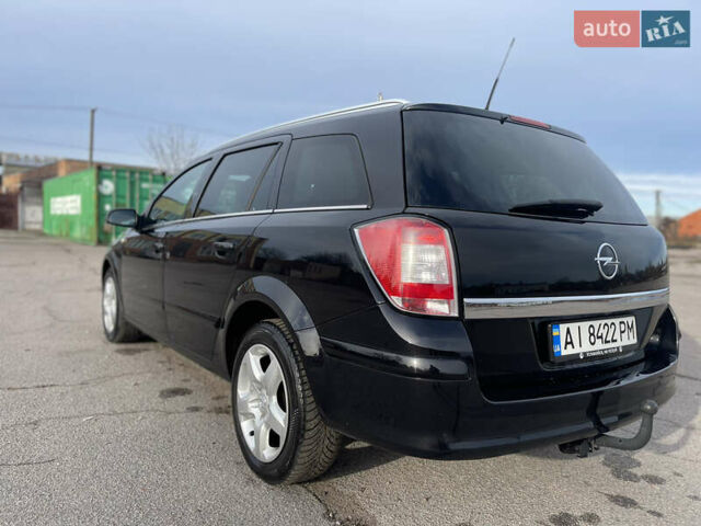 Черный Опель Астра, объемом двигателя 1.6 л и пробегом 239 тыс. км за 5350 $, фото 6 на Automoto.ua