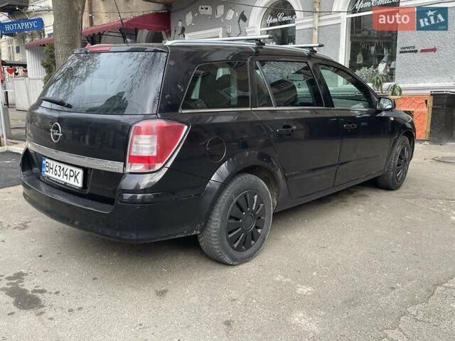 Черный Опель Астра, объемом двигателя 1.6 л и пробегом 255 тыс. км за 3999 $, фото 2 на Automoto.ua
