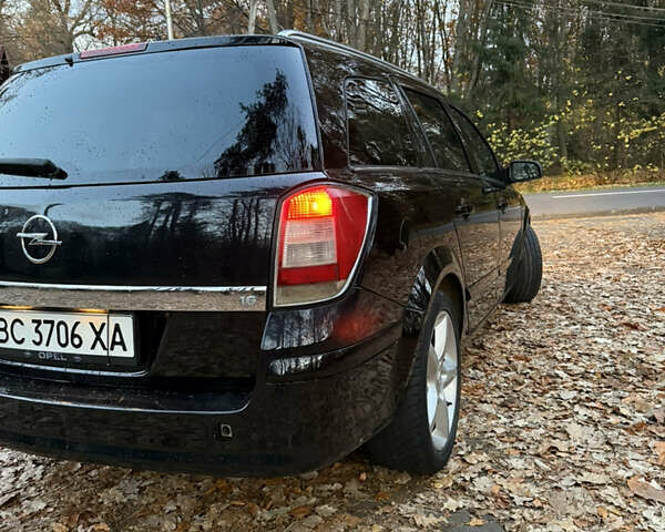 Черный Опель Астра, объемом двигателя 1.6 л и пробегом 310 тыс. км за 4000 $, фото 4 на Automoto.ua