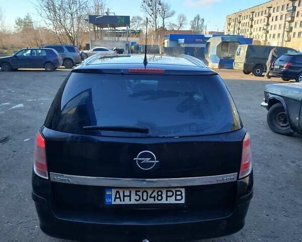 Черный Опель Астра, объемом двигателя 1.9 л и пробегом 294 тыс. км за 4000 $, фото 5 на Automoto.ua